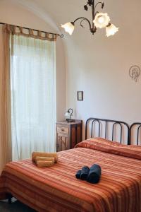 a bedroom with two beds with towels and a window at Villa Maria Antonietta in Vietri sul Mare