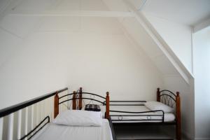 Postel nebo postele na pokoji v ubytování Tiny Boutique Habitat