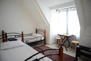 Postel nebo postele na pokoji v ubytování Tiny Boutique Habitat