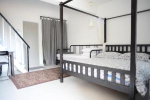Postel nebo postele na pokoji v ubytování Tiny Boutique Habitat