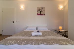 Кровать или кровати в номере Apartments Sestanka