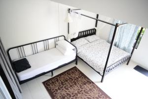 Postel nebo postele na pokoji v ubytování Tiny Boutique Habitat