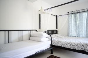 Postel nebo postele na pokoji v ubytování Tiny Boutique Habitat
