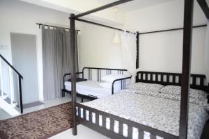 Postel nebo postele na pokoji v ubytování Tiny Boutique Habitat