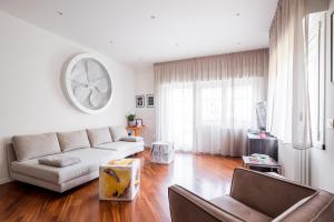 a living room with a couch and a table at The Jasmine Terrace Retreat in Bologna