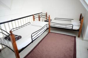 Postel nebo postele na pokoji v ubytování Tiny Boutique Habitat