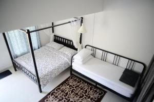 Postel nebo postele na pokoji v ubytování Tiny Boutique Habitat