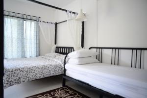 Postel nebo postele na pokoji v ubytování Tiny Boutique Habitat