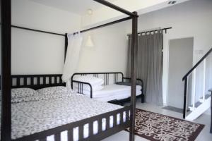 Postel nebo postele na pokoji v ubytování Tiny Boutique Habitat