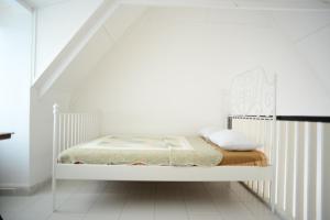 Postel nebo postele na pokoji v ubytování Tiny Boutique Habitat
