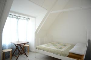 Postel nebo postele na pokoji v ubytování Tiny Boutique Habitat