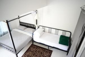Postel nebo postele na pokoji v ubytování Tiny Boutique Habitat
