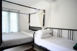 Postel nebo postele na pokoji v ubytování Tiny Boutique Habitat