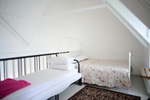 Postel nebo postele na pokoji v ubytování Tiny Boutique Habitat