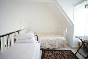 Postel nebo postele na pokoji v ubytování Tiny Boutique Habitat