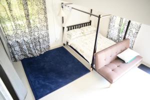 Postel nebo postele na pokoji v ubytování Tiny Boutique Habitat