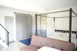 Postel nebo postele na pokoji v ubytování Tiny Boutique Habitat
