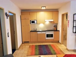 Kuchyňa alebo kuchynka v ubytovaní Apartments Scheffau
