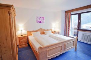 Giường trong phòng chung tại Hotel Berghof