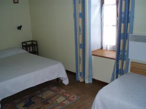 Ένα ή περισσότερα κρεβάτια σε δωμάτιο στο la fario