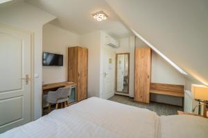 Postel nebo postele na pokoji v ubytování Hotel Diana
