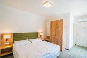 Postel nebo postele na pokoji v ubytování Hotel Diana