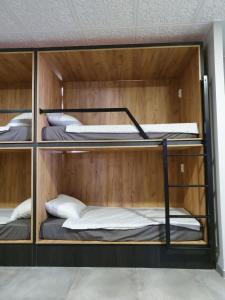 a group of bunk beds in a room at Faro SOLO para MUJERES in Platja d'Aro