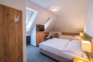 Postel nebo postele na pokoji v ubytování Hotel Diana