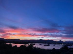 a large body of water with a sunset at B&B Da Lucina in Olbia