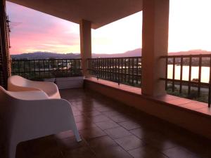 a hotel room with a balcony overlooking the ocean at B&B Da Lucina in Olbia