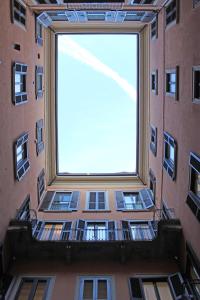 a window that has a bunch of windows on it at Torino48 Guesthouse in Milan