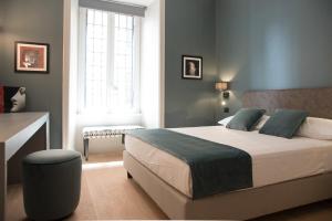 A bed or beds in a room at Domus Alberico