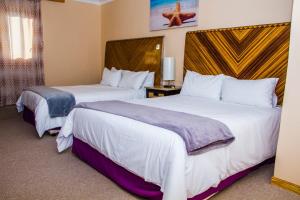 Postel nebo postele na pokoji v ubytování Kosi Bay Hippo Lodge & Resort + 56 fotografií