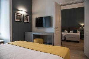 A bed or beds in a room at Domus Alberico