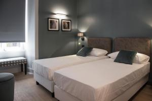 A bed or beds in a room at Domus Alberico