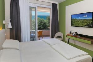 Postel nebo postele na pokoji v ubytování Agriturismo La Rocca + 90 fotografií