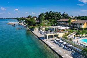 an aerial view of the resort and the water at Lido International in Desenzano del Garda