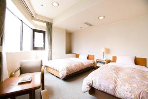Postel nebo postele na pokoji v ubytování Hotel Ohedo