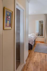 Posteľ alebo postele v izbe v ubytovaní Casa Carminatti Apartments