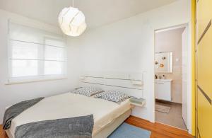 Posteľ alebo postele v izbe v ubytovaní RozART - river marina apartment with free parking
