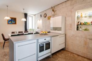 Kuchyňa alebo kuchynka v ubytovaní Casa Carminatti Apartments