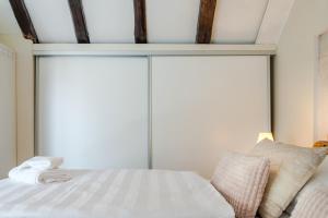 a bedroom with a bed and a large window at Casa Carminatti Apartments in Split