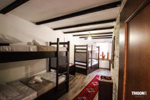 Rúm í herbergi á Trigona Guest House & Hostel