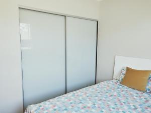 a bedroom with four closets and a bed at Stylish Private Bathroom-Luxurious modern big home in Epping