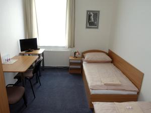 Postel nebo postele na pokoji v ubytování HOTEL STAŘÍČ