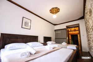 Rúm í herbergi á Trigona Guest House & Hostel