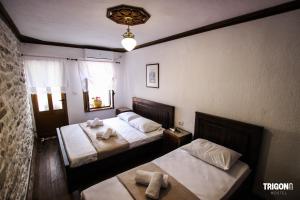 Rúm í herbergi á Trigona Guest House & Hostel