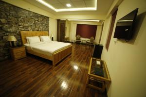 Postel nebo postele na pokoji v ubytování Chinar Resorts