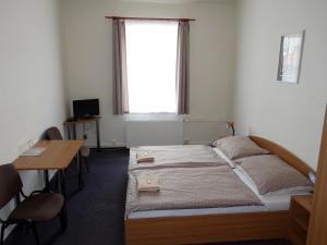 Postel nebo postele na pokoji v ubytování HOTEL STAŘÍČ