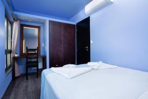 A bed or beds in a room at Villa Menelaos